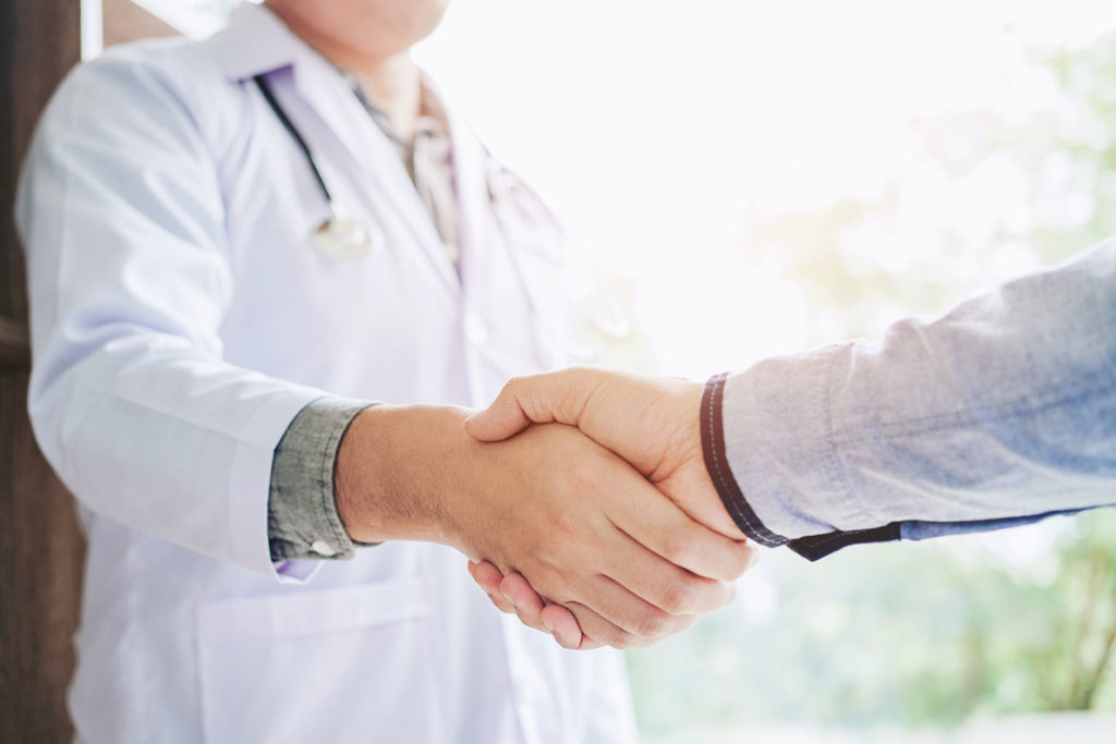 Doctor shaking patient's hand